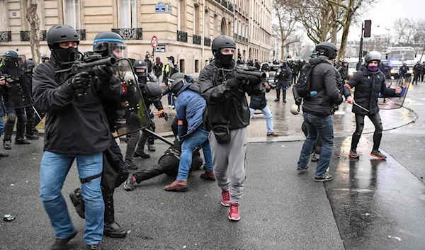 Officers carrying rubber ball launchers during a demonstration in Paris this month. Anger at officers’ use of force has helped fuel the nationwide “Yellow Vest” movement.Credit: Eric Feferberg/Agence France-Presse — Getty Images