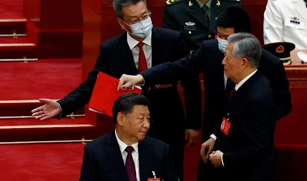 Chinese President Xi Jinping and former Chinese President Hu Jintao at the CCP 20th National Congress on October 22, 2022