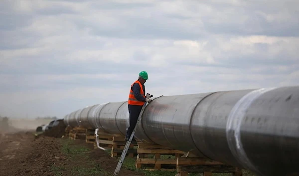 A worker is seen next to a pipe at a construction site on the extension of Russia's TurkStream gas pipeline in Bulgaria (Reuters)