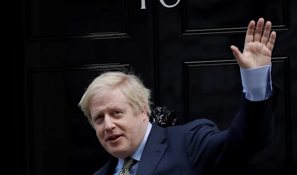 Britain's Prime Minister Boris Johnson returns to 10 Downing Street after meeting with Queen Elizabeth II at Buckingham Palace, London, on Friday, Dec. 13, 2019 (AP Photo/Matt Dunham, File)