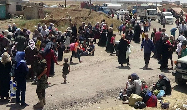 Syrian refugees returning from Lebanon to their country in 2018 (Reuters)