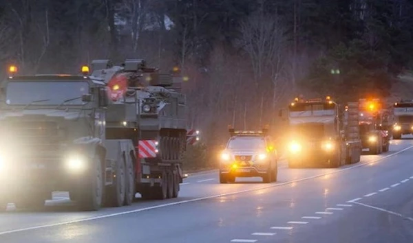 A convoy of British armored vehicles of the Royal Welsh Battlegroup is on the way to Estonia. (EPA)