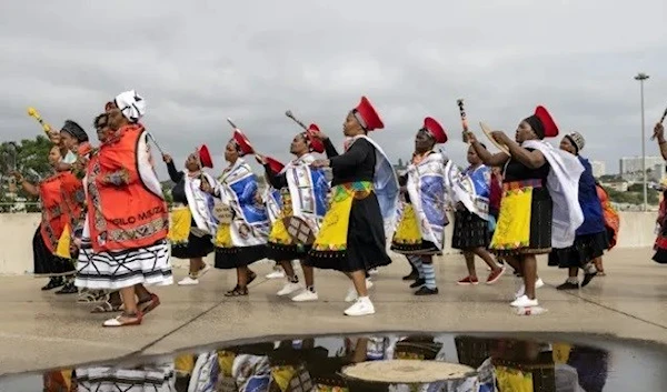 Tens of thousands of people dressed in vibrant regalia celebrated crowning the new king.