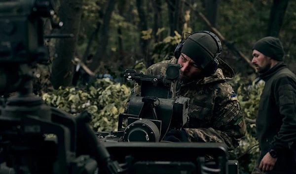 Ukrainian soldiers fire from a US supplied M777 howitzer in Donetsk. (AP)