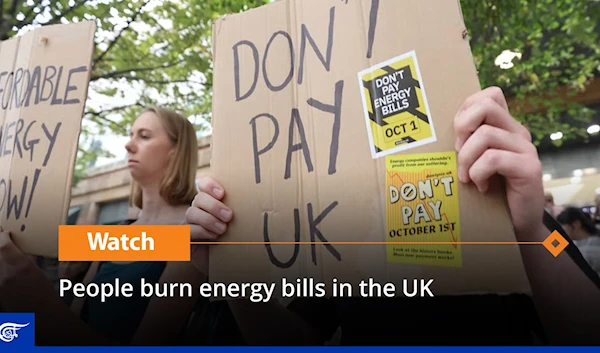 People burn energy bills in the UK