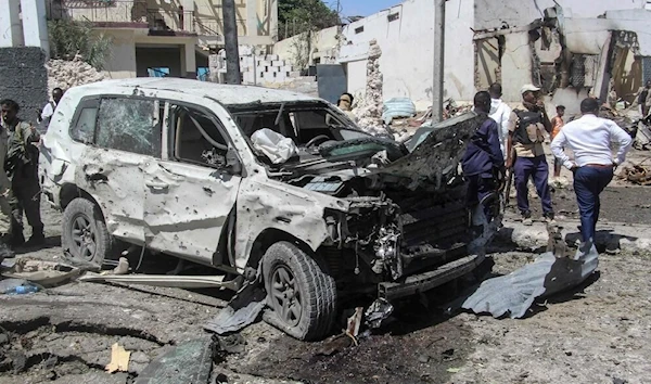 Somalian twin car bomb claims the lives of nine people including senior official (Reuters)