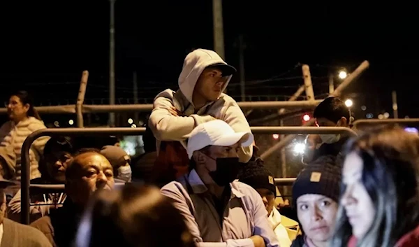 Relatives wait outside the Cotopaxi prison (Reuters)