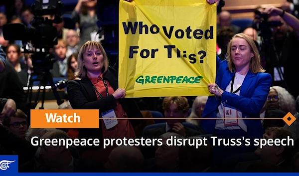 Greenpeace protesters disrupt Truss's speech