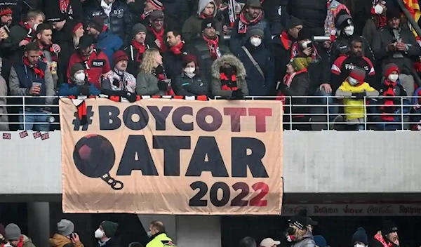 Freiburg fans display a banner calling for a World Cup boycott.