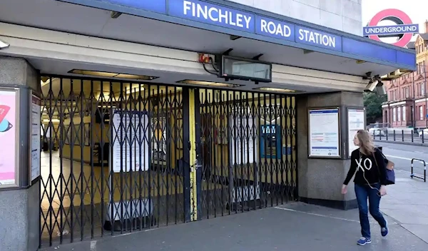 A woman passes the closed underground station at Finchley Road during another recent stoppage. (Alamy)