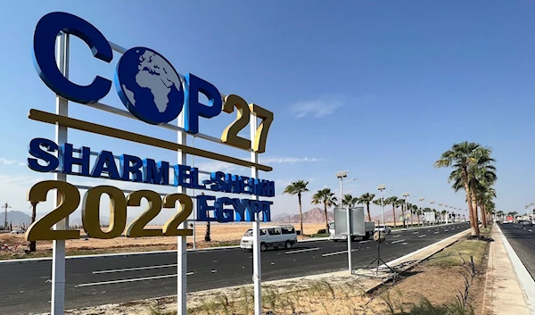 View of a COP27 sign on the road leading to the conference area in Egypt's Red Sea resort town of Sharm el-Sheikh, taken on October 22, as it prepares to host the COP27 summit. Source: Sayed Sheasha/Reuters.