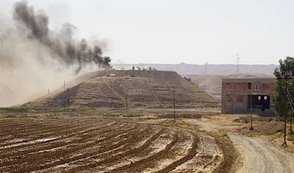 Plumes of smoke in the village of Altrun Krupi (Shawan Nawzad)