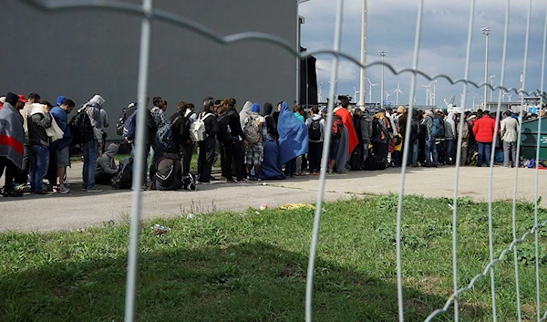 A line of Syrian refugees crossing the border of Hungary and Austria on their way to Germany. Hungary, Central Europe, 6 September 2015.