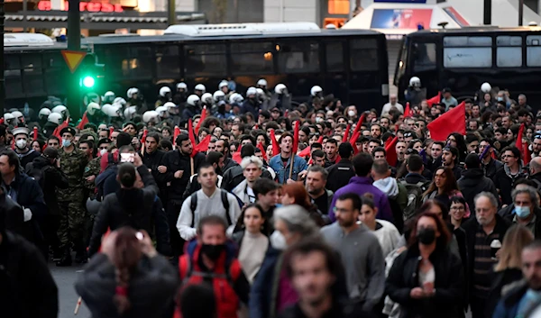 Protestors march as they shoot slogans during a rally, in Athens, Thursday, Nov. 17, 2022 (AP Photo/Michael Varaklas)