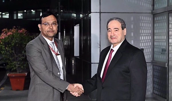 Syrian Foreign Minister Faisal Mekdad (R) arrives in India on November 17, 2022. (Photo via Twitter)