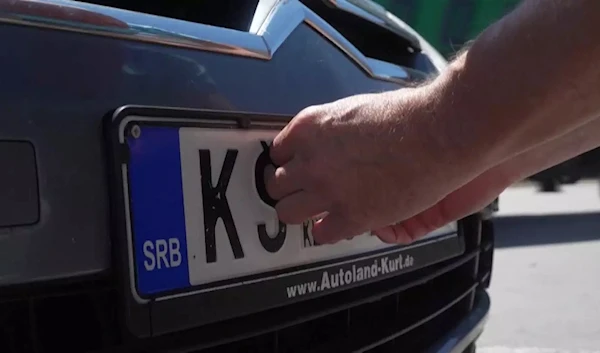 Serbian licence plate is covered at Kosovo border