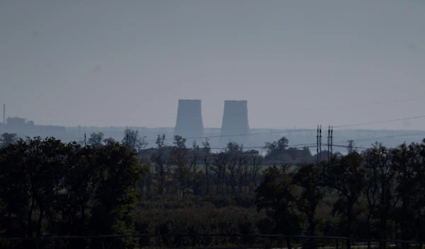 Zaporozhye nuclear power plant is seen from around twenty kilometers away in an area in the Dnipropetrovsk region, Ukraine, Monday, Oct. 17, 2022 (AP Photo/Leo Correa, File)