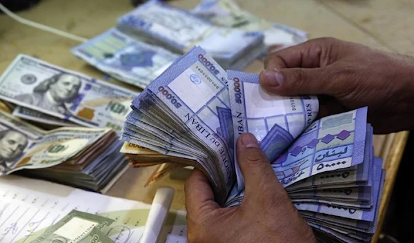 A man counts Lebanese pounds (AP)