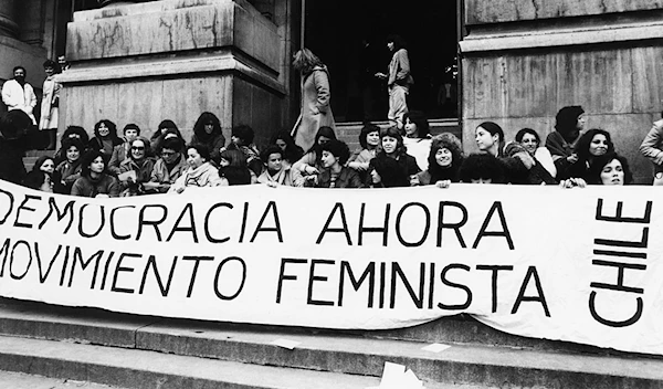 Chilean feminists protest the Augosto Pinochet regime at the Museum of Memory and Human Rights. (Kena Lorenzini)