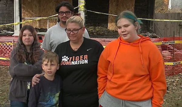 Tender Lehmen (center) is grateful for the Good Samaritan who saved her four children, ages 8, 14, 17 and 22, from a house fire.( CNN)