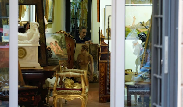 Artworks and antique furniture are displayed inside a shop in Rome, Wednesday, Nov. 9, 2022 (AP Photo/Gregorio Borgia)