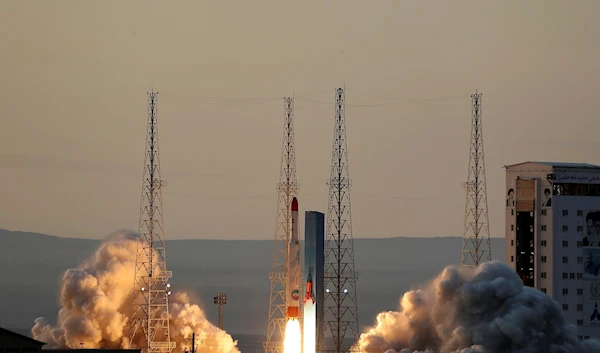 This photo, released by the official website of the Iranian Defense Ministry on December 30, 2021, shows the launching of Simorgh rocket in an undisclosed location in Iran (AP Photo)