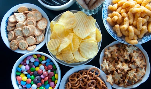 Ultra-processed food examples: Chips, salt crackers, coloring-coated chocolates, and more.