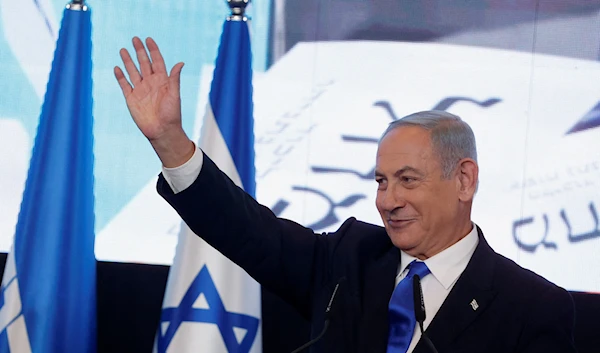 Likud party leader Benjamin Netanyahu waves as he addresses his supporters at his party headquarters during Israel's general election in Jerusalem, November 2, 2022. Source: REUTERS/Ammar Awad.