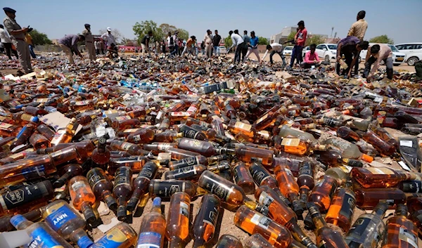 Toxic alcohol bottles gathered in the raid in India (AP)