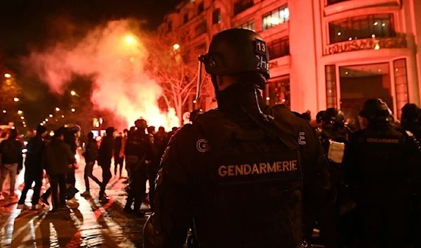 Police in riot gear were also called to disperse crowds in Paris after France's win over Morocco