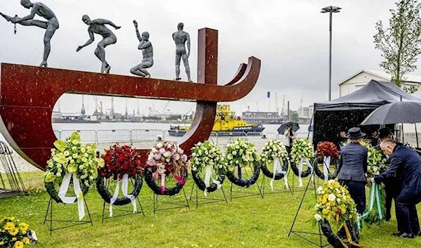 Rotterdam's Dutch Mayor Ahmed Aboutaleb lays a wreath of flowers during the commemoration of the abolition of slavery in Suriname and the Caribbean Netherlands, in Rotterdam, on June 30, 2022. Source: Robin UTRECHT / ANP / AFP