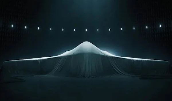 The Northrop Grumman B-21 Raider stands ready to be unveiled. (Northrop Grumman photograph)