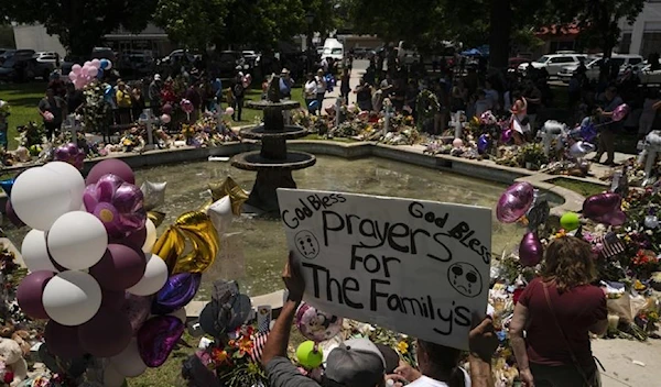 A memorial set up in a town square to honor the victims killed (AP)