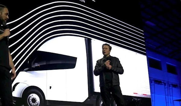 Tesla Chief Executive Elon Musk (right) speaks with Dan Priestly, Senior Manager of Tesla Semi Truck Engineering at the vehicles delivery event. (Reuters)