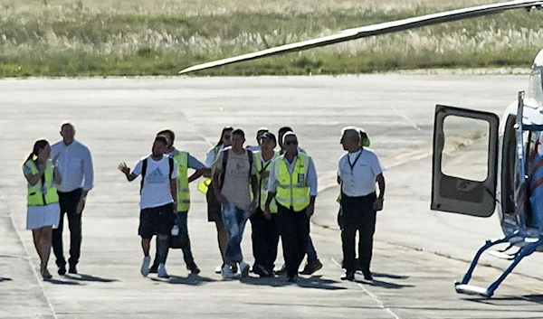 Messi and the team aboard the helicopter (CNN)