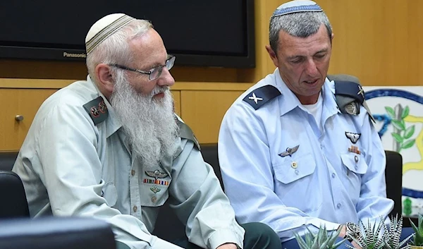 Rabbi Col. Eyal Karim (left), nominated back in 2016 to become IOF chief rabbi, sits next to his predecessor, Brig. Gen. Rafi Peretz, on April 21, 2016 (Israeli Security Ministry)