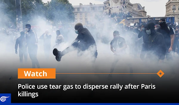 Police use tear gas to disperse rally after Paris killings