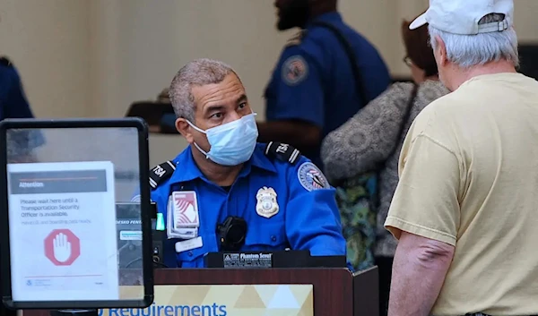 A TSA agent wears a face mask (Getty Images)