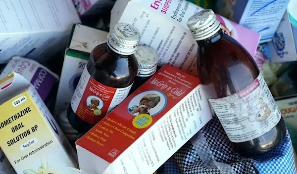 A photograph shows collected cough syrups in The Gambia’s Banjul city on 6 October 2022 (AFP via Getty Images)