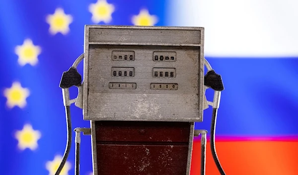 Model of petrol pump is seen in front of EU and Russian flag colors in this illustration taken March 25, 2022. (REUTERS)