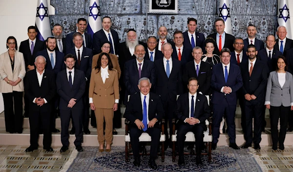 Members of the new Israeli occupation cabinet, headed by Prime Minister Benjamin Netanyahu, pose for a group photo at the president's residence in occupied Al-Quds, on December 29, 2022 (Flash90)