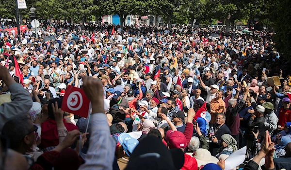 Tunisian demonstrators gather during a protest against Tunisian President Kais Saied in Tunis, Tunisia, Sunday, May 15, 2022 (AP Photo/Hassene Dridi)