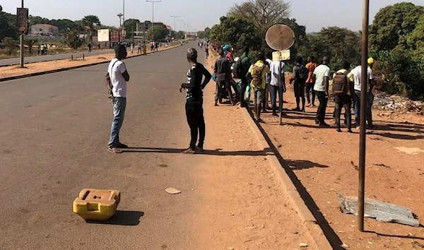 People near the Guinea-Bissau government palace in the capital, Bissau, on Tuesday. (EPA)