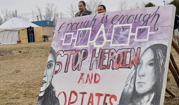 A sign on the Oneida Nation highlights how opioids has affected the community