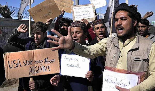 Afghan protesters during a protest condemning President Joe Biden's decision, in Kabul (AP)