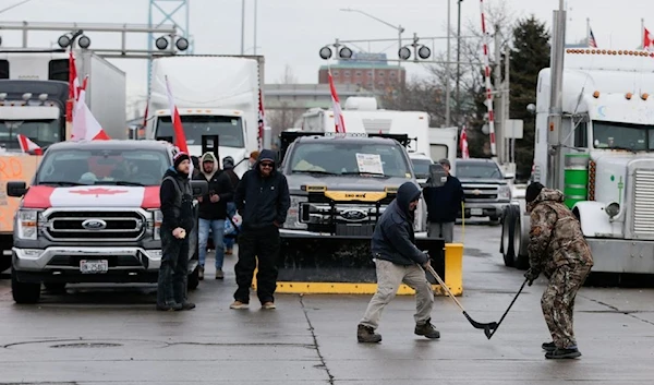 Vehicles blocking the route of the Ambassador bridge, which links Detroit and Windsor