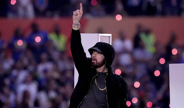 Eminem takes a kneel during Super bowl half time performance