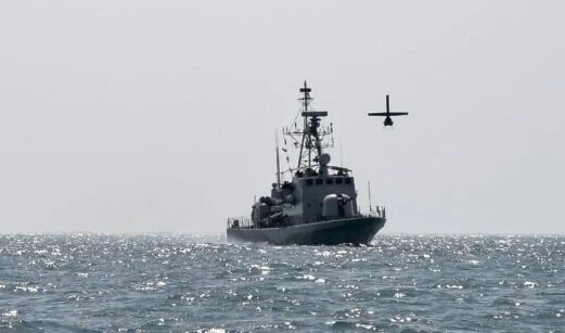 A US Navy Martin UAV drone flies over the Gulf waters as the Royal Bahrain Naval Force (RBNF) Abdulrahman Al Fadhel takes part in a joint naval exercise between the US 5th Fleet Command and Bahraini forces, October 26, 2021. (Mazen Mahdi/AFP)