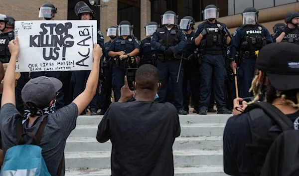 Demonstrators face off with law enforcement outside of the Austin Police Department Headquarters on May 31, 2020. (KUT)