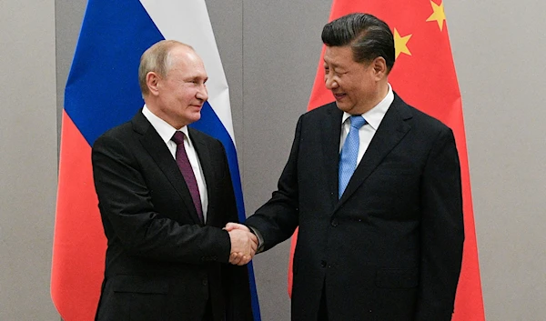 Russian President Vladimir Putin and Chinese President Xi Jinping in Brasilia, Brazil, November 13, 2019 (Reuters)